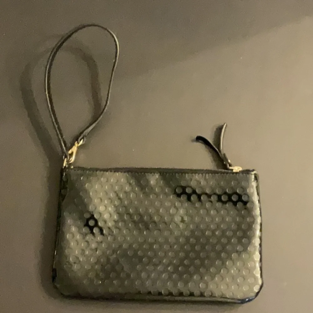 Kate Spade shiny black wristlet w/dots & logo spades
